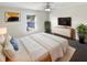 Relaxing bedroom featuring a comfortable queen-sized bed and modern decor at 30208 Rattana Ct, Wesley Chapel, FL 33545