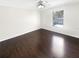 Cozy bedroom with hardwood floors and a view from a bright window at 30208 Rattana Ct, Wesley Chapel, FL 33545