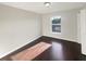 Bedroom with natural light from a bright window and a door leading to other rooms at 30208 Rattana Ct, Wesley Chapel, FL 33545