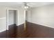 Spacious bedroom featuring wood flooring and a fan at 30208 Rattana Ct, Wesley Chapel, FL 33545