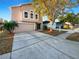 Charming two-story home with a well-manicured lawn and a spacious driveway at 30208 Rattana Ct, Wesley Chapel, FL 33545