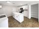 Spacious kitchen with white cabinetry, an island, and stainless steel appliances at 30208 Rattana Ct, Wesley Chapel, FL 33545