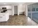 Beautiful kitchen with modern white cabinets, stainless appliances, and a breakfast nook at 30208 Rattana Ct, Wesley Chapel, FL 33545