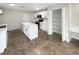 Modern kitchen with white cabinetry, stainless steel appliances, and spacious island at 30208 Rattana Ct, Wesley Chapel, FL 33545