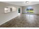 Bright, open living room with sleek tile flooring and lots of natural light at 30208 Rattana Ct, Wesley Chapel, FL 33545