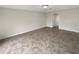 A spacious living room showcases tile flooring and neutral walls, ready for personal touches at 30208 Rattana Ct, Wesley Chapel, FL 33545