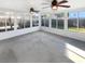 Bright sunroom with windows all around and ceiling fans at 30208 Rattana Ct, Wesley Chapel, FL 33545