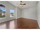 Bright bedroom with wood floors and a view from a large window at 30208 Rattana Ct, Wesley Chapel, FL 33545