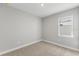 Bright bedroom with neutral walls and carpeted floors at 522 Sun Chaser Dr, Nokomis, FL 34275