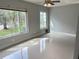 Bright living room with large windows and tile floors at 2386 Sumatran Way # 26, Clearwater, FL 33763