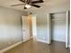 Well-lit bedroom with tile floors and ceiling fan at 2386 Sumatran Way # 26, Clearwater, FL 33763