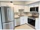 Updated kitchen featuring stainless steel appliances and white cabinets at 2386 Sumatran Way # 26, Clearwater, FL 33763