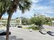 Community view with parking lot and building at 2386 Sumatran Way # 26, Clearwater, FL 33763