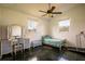 Small bedroom with twin bed, vanity, and a treadmill at 37600 Largo Ln, Dade City, FL 33523