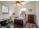Bright bedroom with twin bed, desk, and dresser at 37600 Largo Ln, Dade City, FL 33523