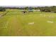Aerial view of equestrian property with arena, barn, and jump course at 37600 Largo Ln, Dade City, FL 33523