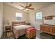 Main bedroom with a queen bed and dresser at 37600 Largo Ln, Dade City, FL 33523