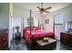 Spacious bedroom with a four-poster bed and ample closet space at 37600 Largo Ln, Dade City, FL 33523