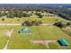 Aerial view of farm with barn and riding area at 37600 Largo Ln, Dade City, FL 33523