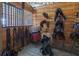 Well-organized tack room with various saddles, bridles, and blankets at 37600 Largo Ln, Dade City, FL 33523