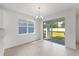 Bright dining area with sliding glass doors leading to the backyard patio at 9589 Vibrant Lane, Venice, FL 34292