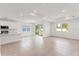 Spacious living room featuring tile floors, recessed lighting, and a view of the backyard at 9589 Vibrant Lane, Venice, FL 34292