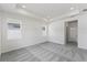 Spacious main bedroom featuring recessed lighting, plush carpeting, and plenty of natural light at 9589 Vibrant Lane, Venice, FL 34292