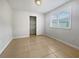 Bright bedroom with tile flooring and spacious closet at 5902 Guarino Dr, Sarasota, FL 34238