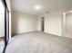 Bedroom with carpet, natural light, and walk in closet at 7483 Carnoustie Dr # 5B, Sarasota, FL 34238