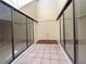 Covered patio with sliding glass doors providing a private outdoor retreat at 7483 Carnoustie Dr # 5B, Sarasota, FL 34238