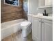 This bathroom features a tub, toilet, and modern vanity at 4011 Mesa Ave, Sarasota, FL 34233
