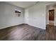 This bedroom features wood-look flooring and natural light at 4011 Mesa Ave, Sarasota, FL 34233
