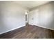 The bedroom has wood-look floors, a double door closet and neutral paint at 4011 Mesa Ave, Sarasota, FL 34233