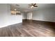 Large open-concept living room and kitchen with hardwood floors and recessed lighting at 4011 Mesa Ave, Sarasota, FL 34233