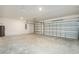 Spacious garage with concrete flooring and an automatic door for easy access at 5637 Ocarina Rd, North Port, FL 34291