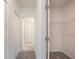 Hallway view showcasing easy access to bathroom and closet storage at 5637 Ocarina Rd, North Port, FL 34291