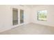 Office space featuring double French doors and a large window at 5637 Ocarina Rd, North Port, FL 34291