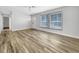 Living room featuring wood-look floors and large windows at 6331 Jordan St, North Port, FL 34287