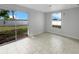 Bedroom with tile floors and sliding glass doors to backyard at 6331 Jordan St, North Port, FL 34287