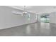 This well-lit living room has sliding glass doors leading to the backyard at 9577 Vibrant Lane, Venice, FL 34292