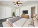 Bright bedroom with double doors leading to a large closet and en-suite bathroom at 3424 100Th E Ct, Palmetto, FL 34221