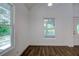 Bright dining room with hardwood floors and large windows at 34392 Broken Stone St, Webster, FL 33597
