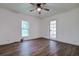 Bright bedroom with hardwood floors, ceiling fan, and French doors at 34392 Broken Stone St, Webster, FL 33597