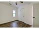 Spacious bedroom with hardwood floors and ceiling fan at 34392 Broken Stone St, Webster, FL 33597