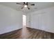 Spacious bedroom with hardwood floors, double closets and ceiling fan at 34392 Broken Stone St, Webster, FL 33597