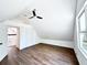 Large bedroom with a ceiling fan, closet and wood-look flooring at 34392 Broken Stone St, Webster, FL 33597