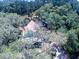 Bird's eye view of a house surrounded by trees at 34392 Broken Stone St, Webster, FL 33597
