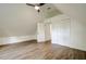 Bright bedroom with sloped ceilings, double door closet and an interior door at 34392 Broken Stone St, Webster, FL 33597