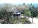 House nestled in a wooded area, accessible by a long driveway at 34392 Broken Stone St, Webster, FL 33597
