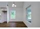 Bright dining room with hardwood floors and large windows at 34392 Broken Stone St, Webster, FL 33597